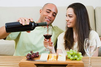man-pouring-glass-of-wine-for-his-wife.jpg